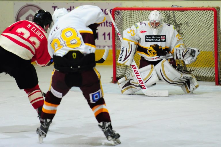 Dan Pye and Richie Lawson ensure Stars' Michael Elder's shot stays out of the net.