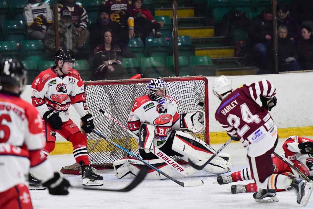 Harry Harley scores high over the glove hand of Hewitt