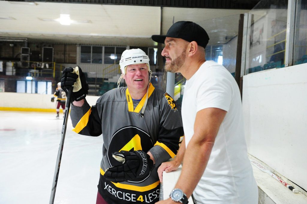 General Manager Paul Matthews and Player Coach David Longstaff oversee the warmup session