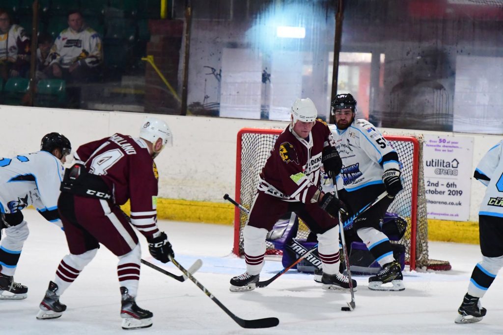 David Longstaff protects the puck