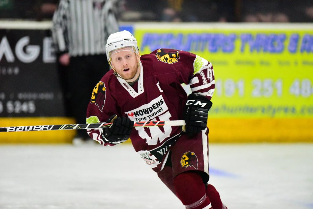 Dean Holland goes puck hunting to try to get his hat trick