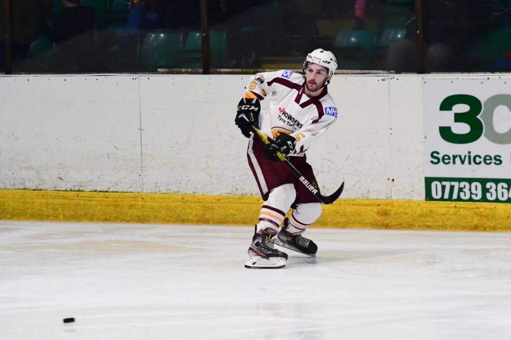 Matty McDonald with a cross ice pass