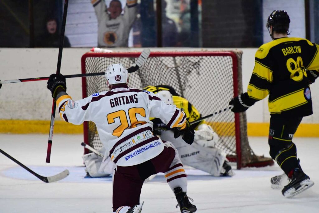 Rolands Gritāns scores a shorty from his knees