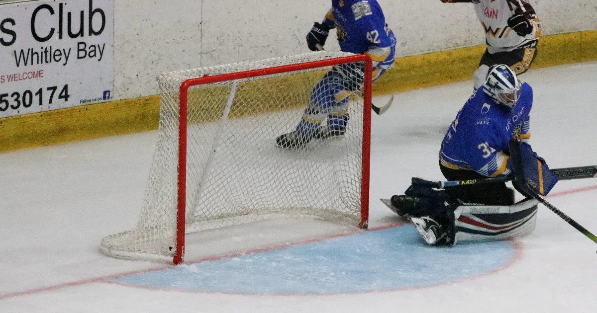 The puck nestles in the back of the Kestrels' net