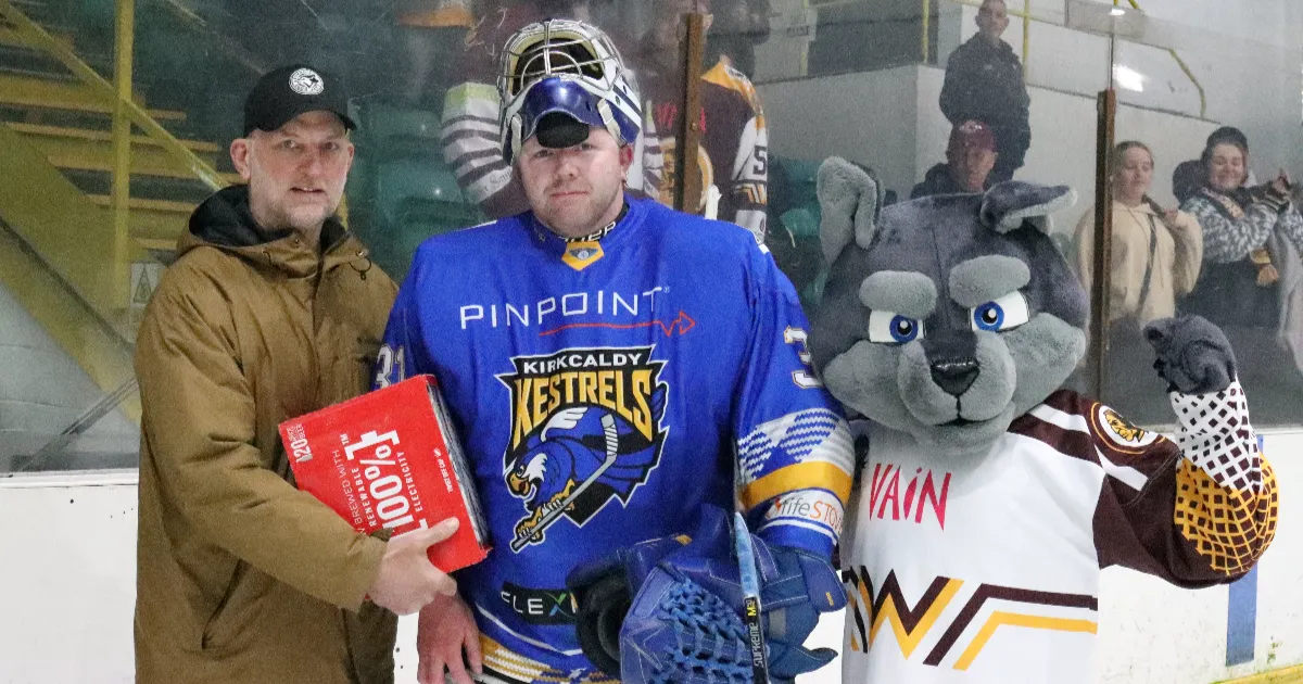 Kestrels netminder Craig Holland receives his Man of the Match award from former player Mike Ware